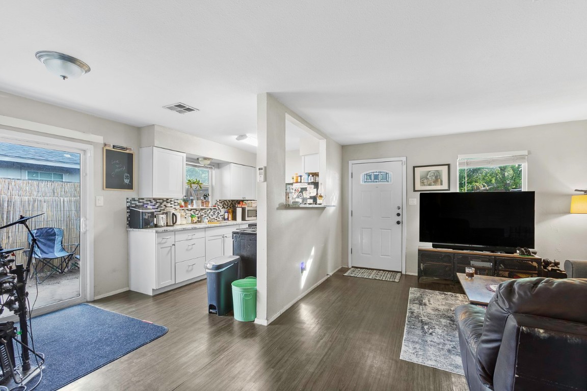 2003 Conestoga Trail, Unit B Austin, TX 78744 - Photo 8 of 18 a kitchen with cabinets and wooden floor