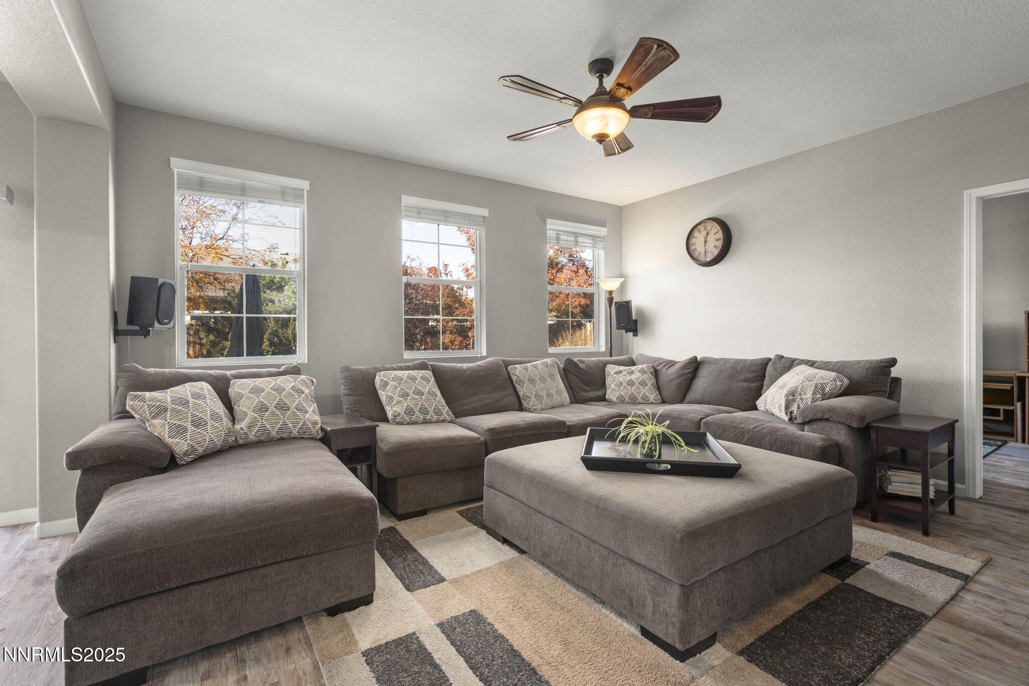 8963 Wynne Street Reno, NV 89506 - Photo 14 of 32 a living room with furniture a large window and a table