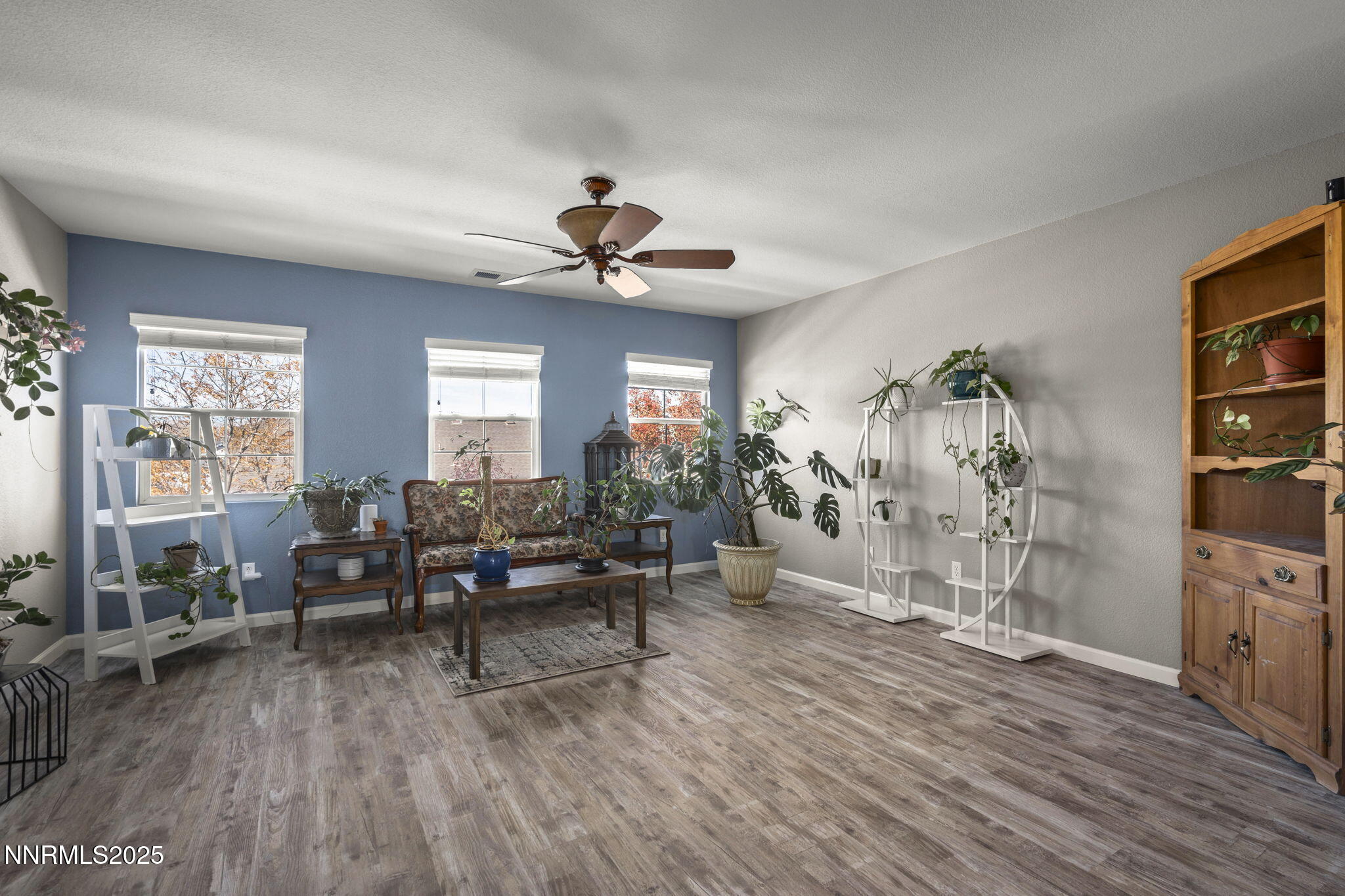 8963 Wynne Street Reno, NV 89506 - Photo 19 of 32 a living room with furniture and wooden floor