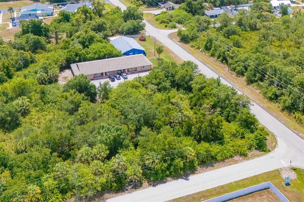 25018 Harbor View Road Punta Gorda, FL 33980 - Photo 7 of 12 a view of a yard with potted plants
