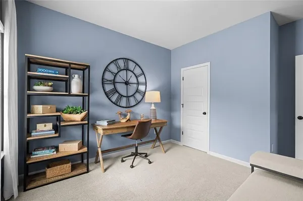 a view of workspace with a window and a chair