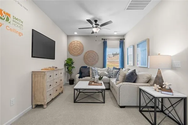 a living room with furniture a large window and a flat screen tv