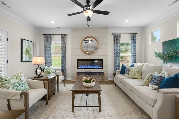 a living room with furniture and a large window