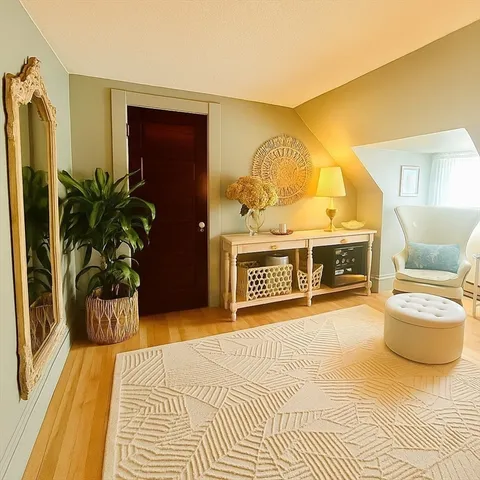 a bedroom with a bed and a potted plant