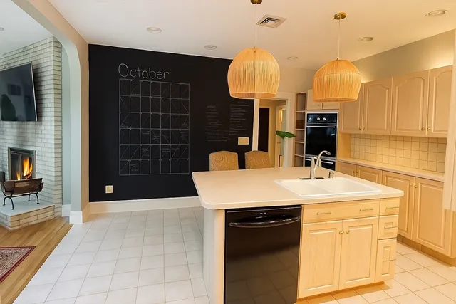 a kitchen with a sink and a refrigerator