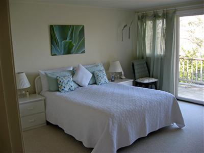 111 Goose Point Road Centerville, MA 02601 - Photo 14 of 21 a bedroom with a bed and large window