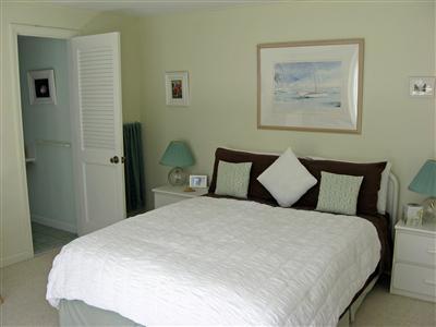 111 Goose Point Road Centerville, MA 02601 - Photo 15 of 21 a large bed in a bedroom next to a small yard
