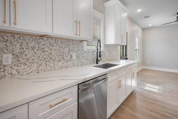 a kitchen with a sink and cabinets