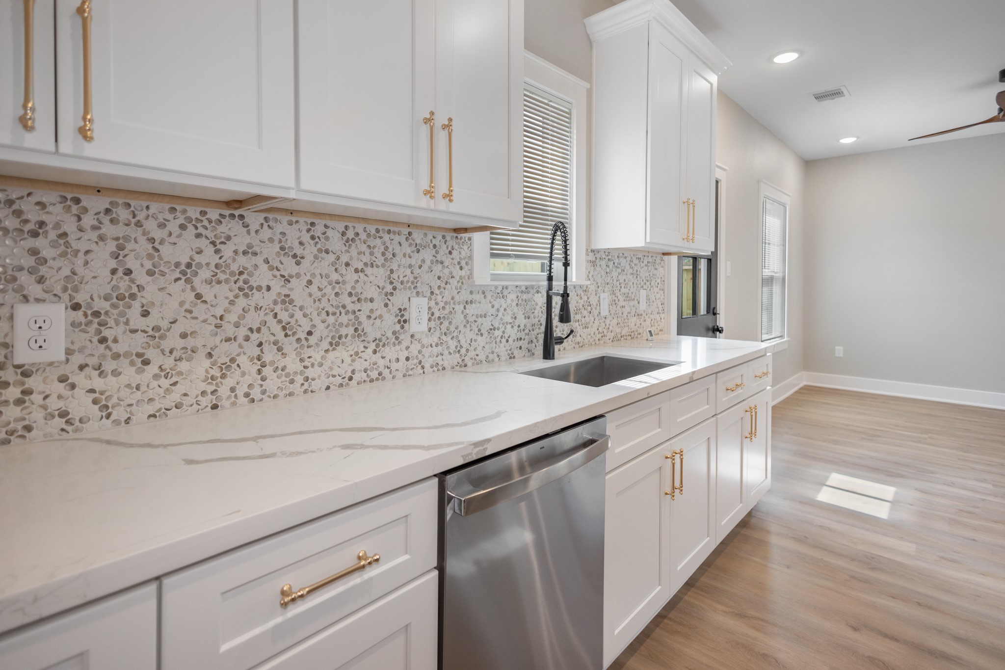 5036 Mallow Street, Unit A Houston, TX 77033 - Photo 19 of 36 a kitchen with a sink and cabinets