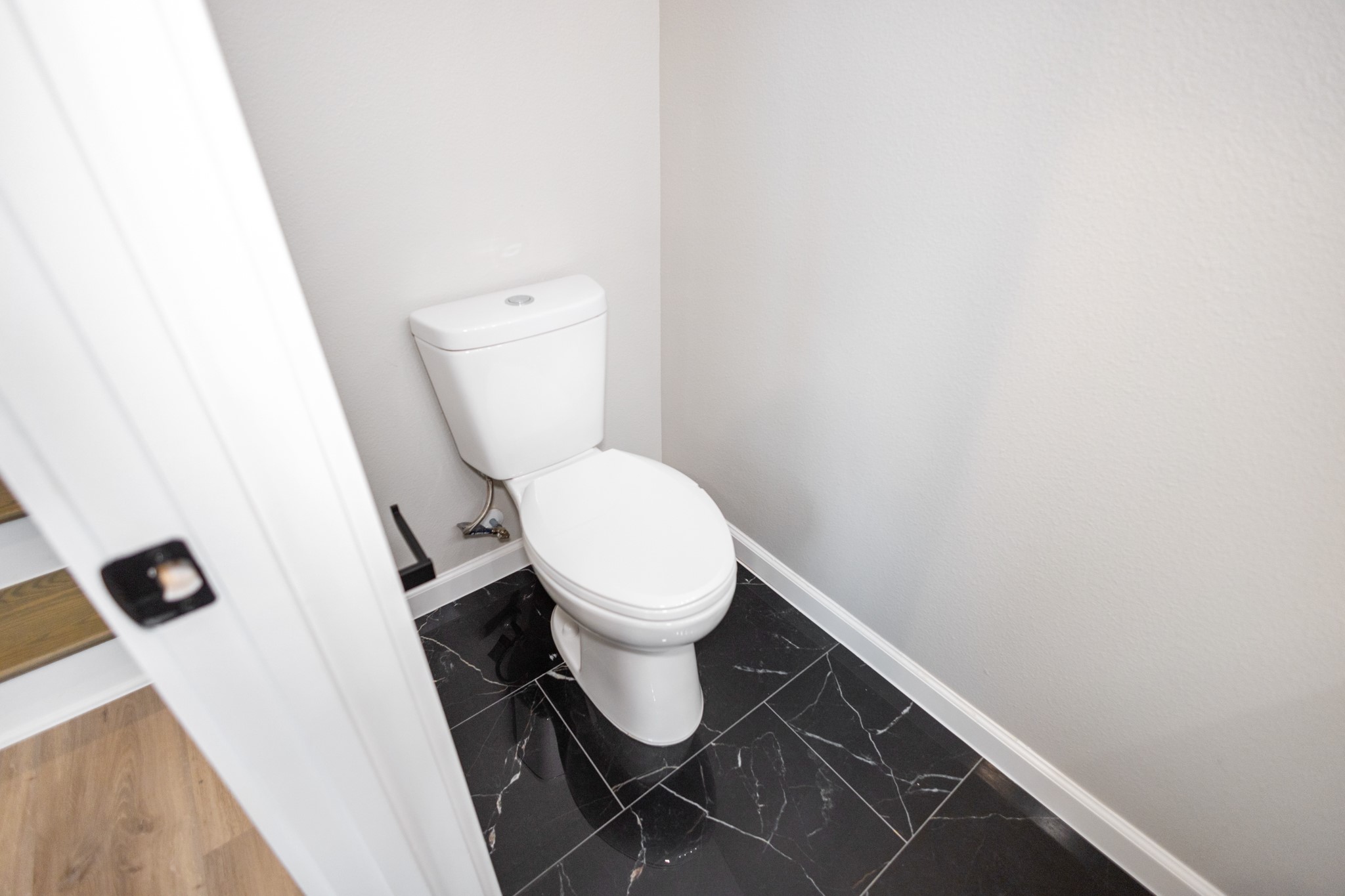 5036 Mallow Street, Unit A Houston, TX 77033 - Photo 22 of 36 a bathroom with a toilet and a shower