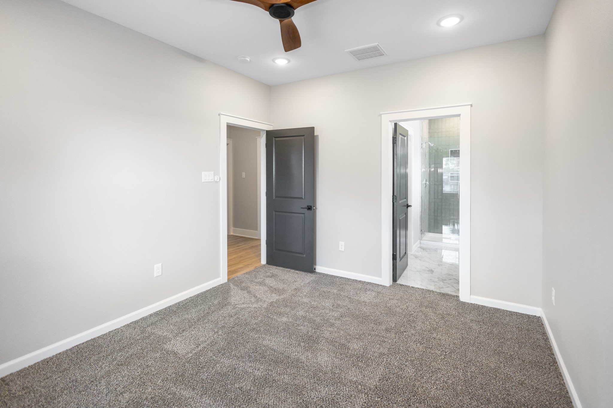 5036 Mallow Street, Unit A Houston, TX 77033 - Photo 24 of 36 an empty room with an entryway and fan