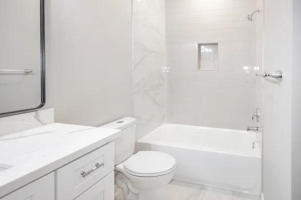 a bathroom with a sink a toilet and a bathtub