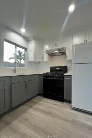 a kitchen with a sink and a stove