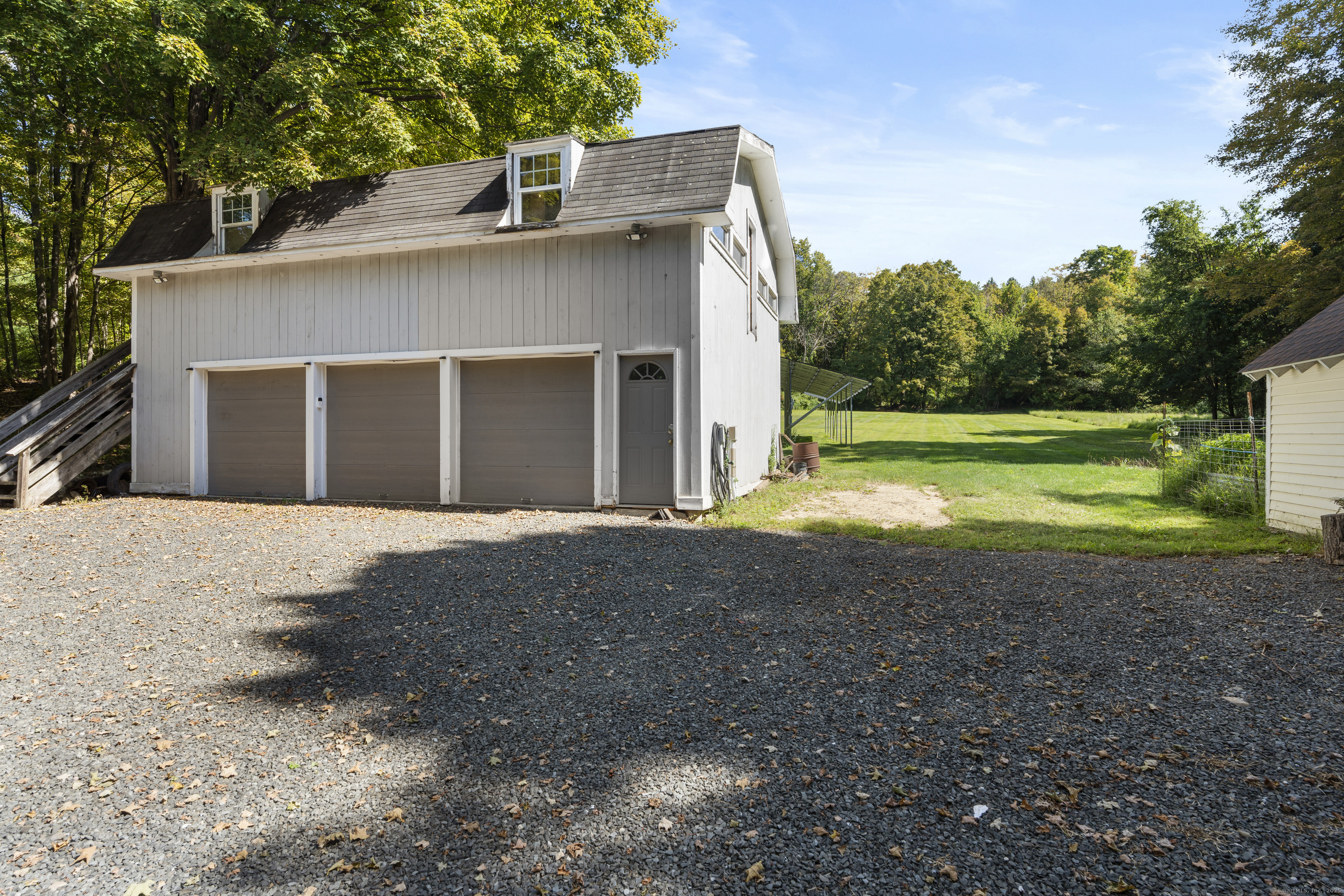 74 Middle Quarter Road Woodbury, CT 06798 - Photo 11 of 38 a view of a house with backyard and trees