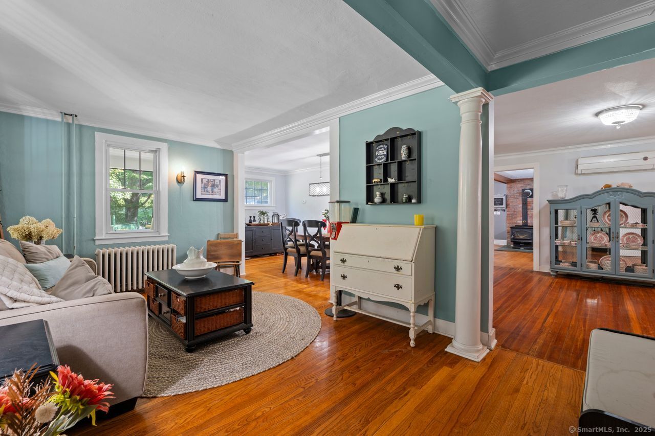 74 Middle Quarter Road Woodbury, CT 06798 - Photo 12 of 38 a living room with furniture and a wooden floor