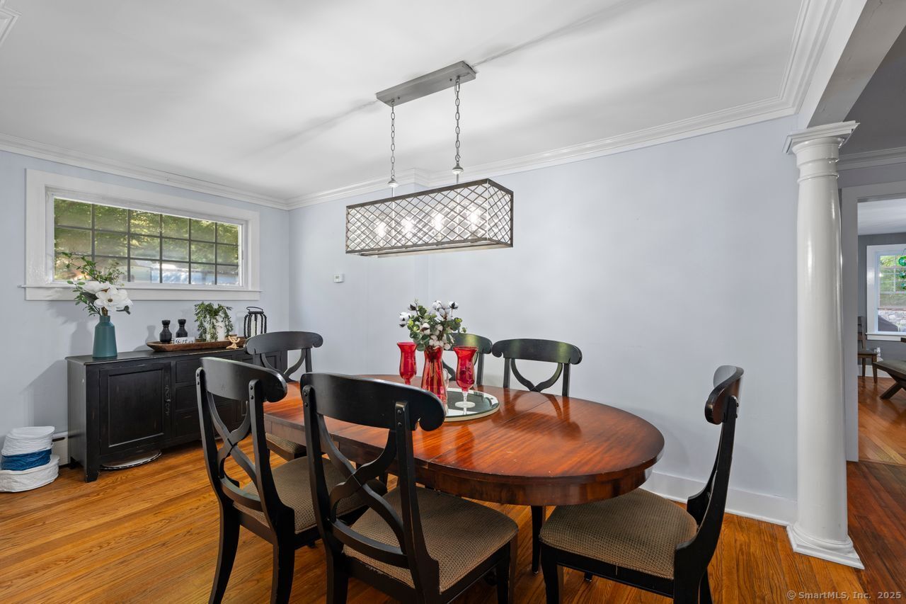 74 Middle Quarter Road Woodbury, CT 06798 - Photo 15 of 38 a view of a dining room with furniture window and wooden floor