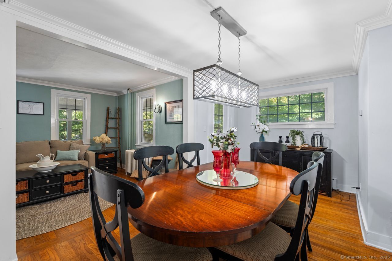 74 Middle Quarter Road Woodbury, CT 06798 - Photo 17 of 38 a view of a dining room with furniture window and wooden floor