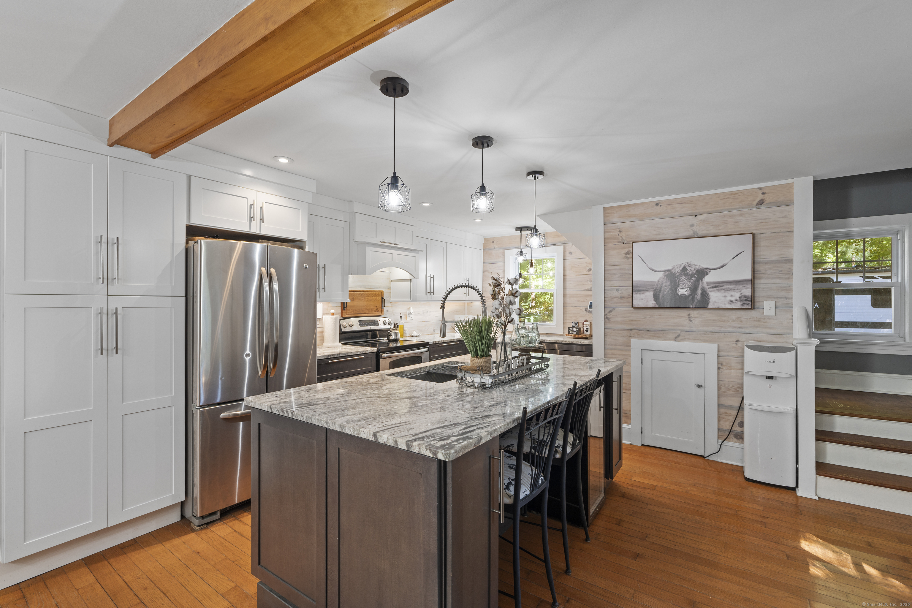 74 Middle Quarter Road Woodbury, CT 06798 - Photo 25 of 38 a kitchen with stainless steel appliances granite countertop a refrigerator a stove and a wooden floors