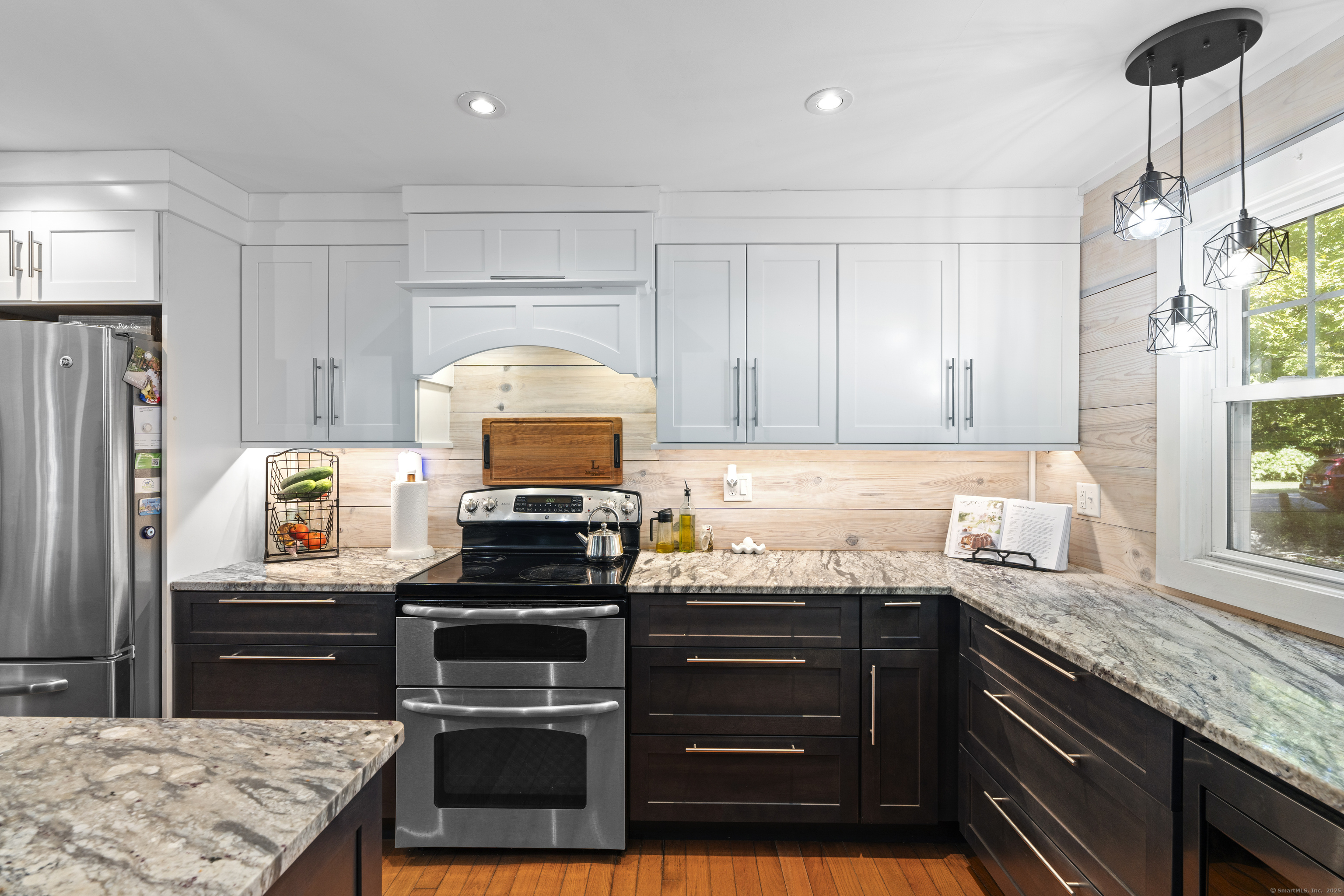 74 Middle Quarter Road Woodbury, CT 06798 - Photo 27 of 38 a kitchen with granite countertop a stove cabinets and refrigerator