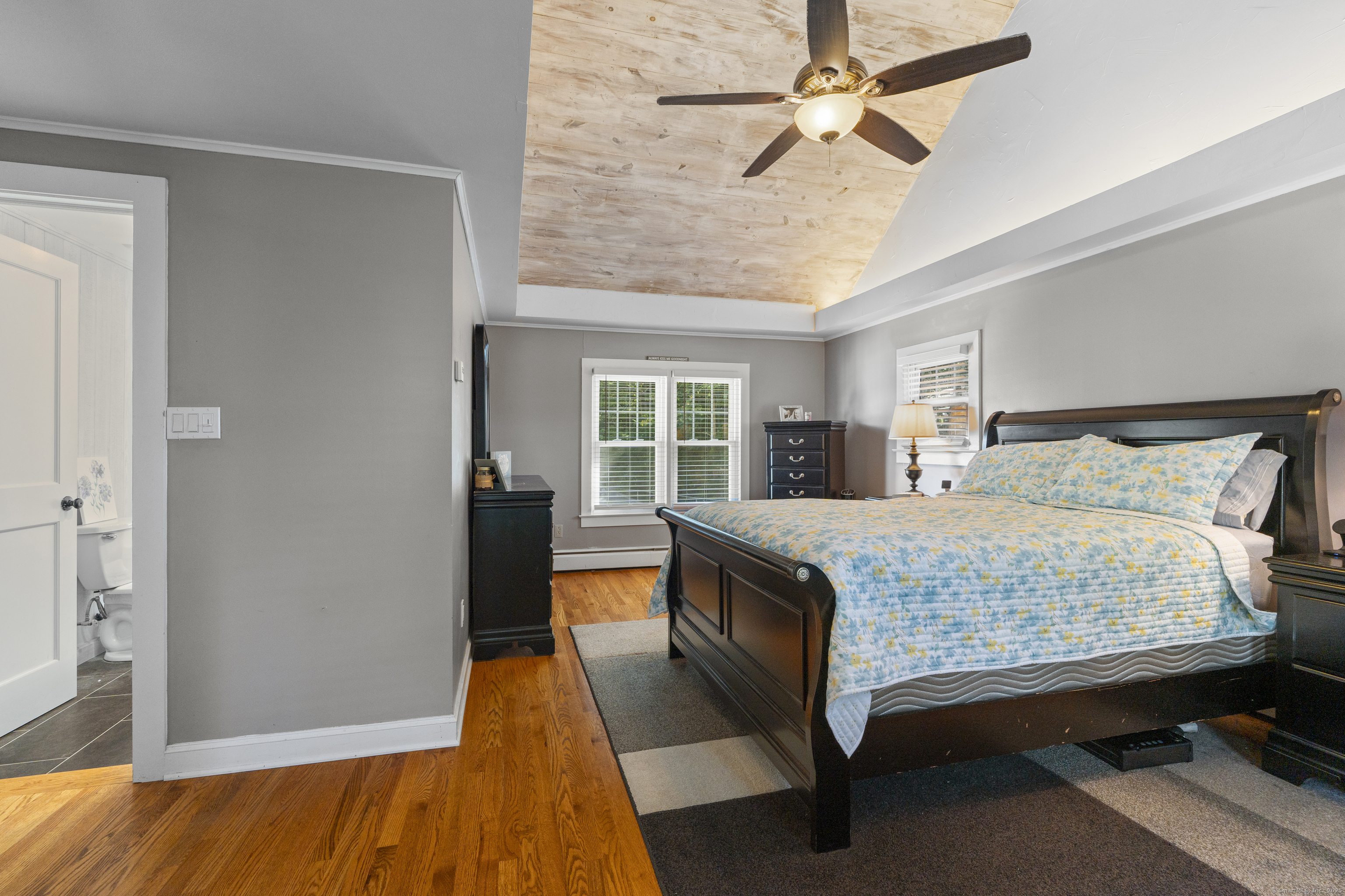 74 Middle Quarter Road Woodbury, CT 06798 - Photo 32 of 38 a bedroom with a bed and a chandelier