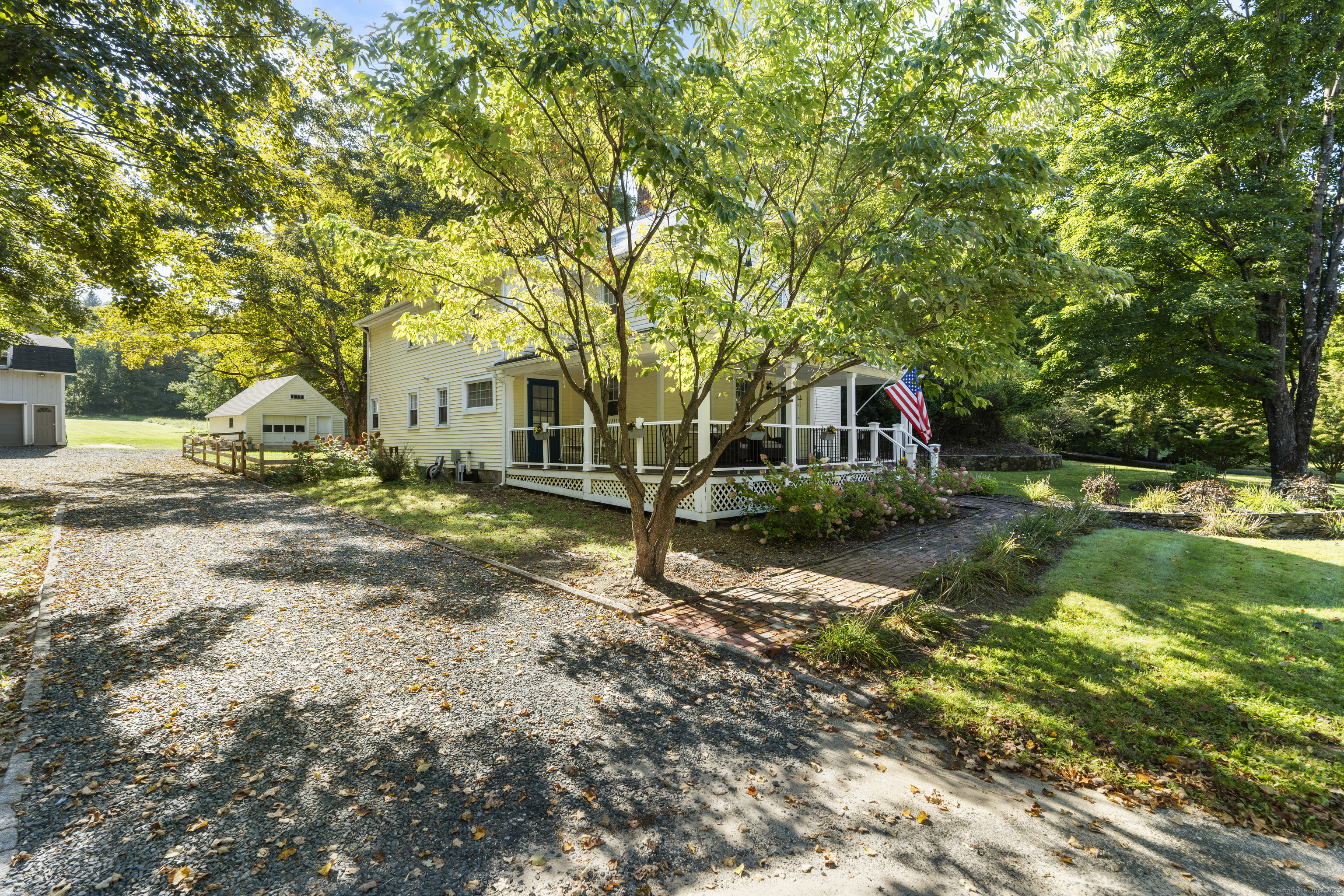 74 Middle Quarter Road Woodbury, CT 06798 - Photo 4 of 38 a view of a house with backyard and sitting area