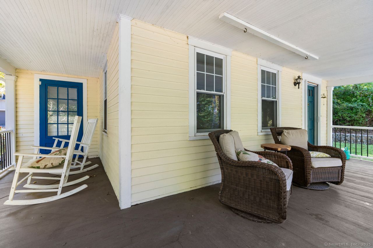 74 Middle Quarter Road Woodbury, CT 06798 - Photo 5 of 38 a living room with furniture and a floor to ceiling window