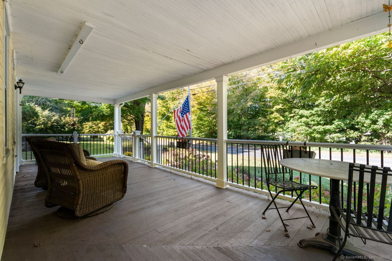 74 Middle Quarter Road Woodbury, CT 06798 - Photo 6 of 38 a view of a patio with wooden floor