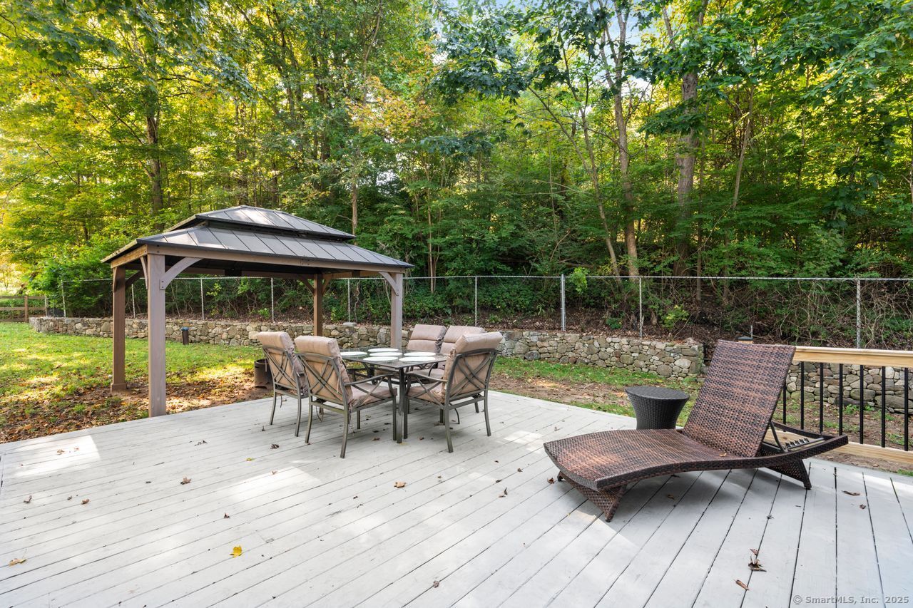 74 Middle Quarter Road Woodbury, CT 06798 - Photo 10 of 38 a view of backyard with swimming pool and seating space