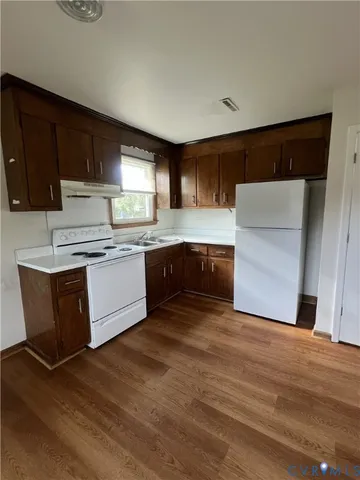 a view of kitchen with wooden floor