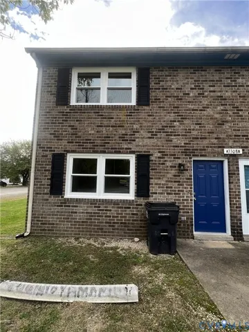 a brick house with a yard