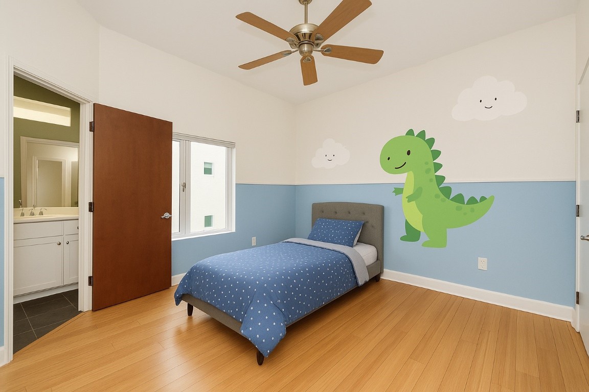 1610 Calumet Street Houston, TX 77004 - Photo 12 of 26 Bright and inviting secondary bedroom with large windows, warm bamboo flooring, a ceiling fan for year-round comfort, and a private en suite bath.