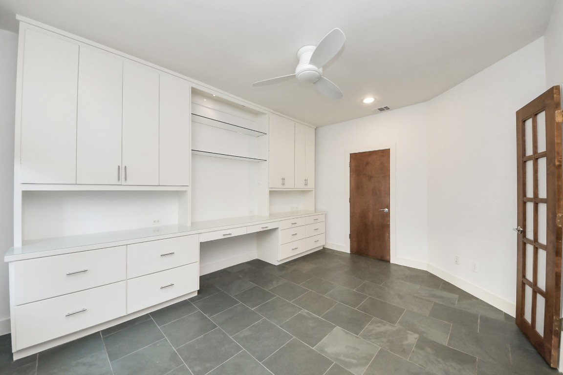 1610 Calumet Street Houston, TX 77004 - Photo 17 of 26 Large built in cabinetry with desk, drawers and