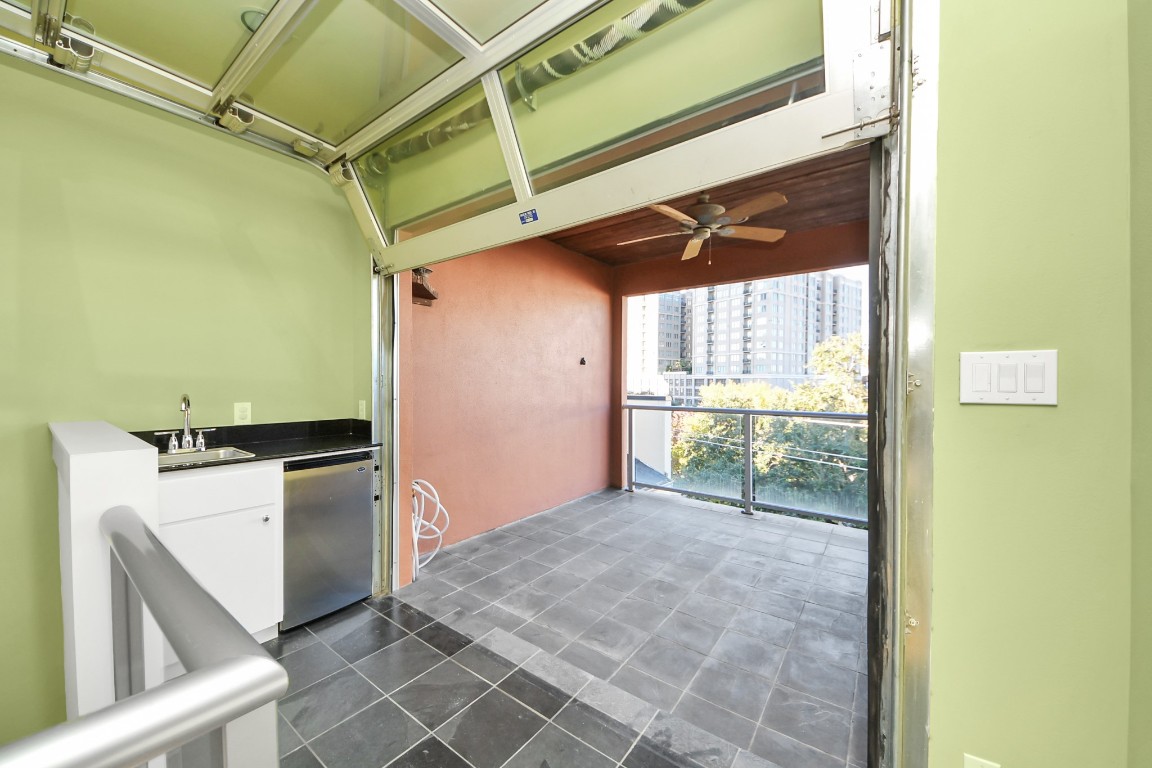 1610 Calumet Street Houston, TX 77004 - Photo 21 of 26 Wet bar on left, entrance to roof top patio is a glass garage door