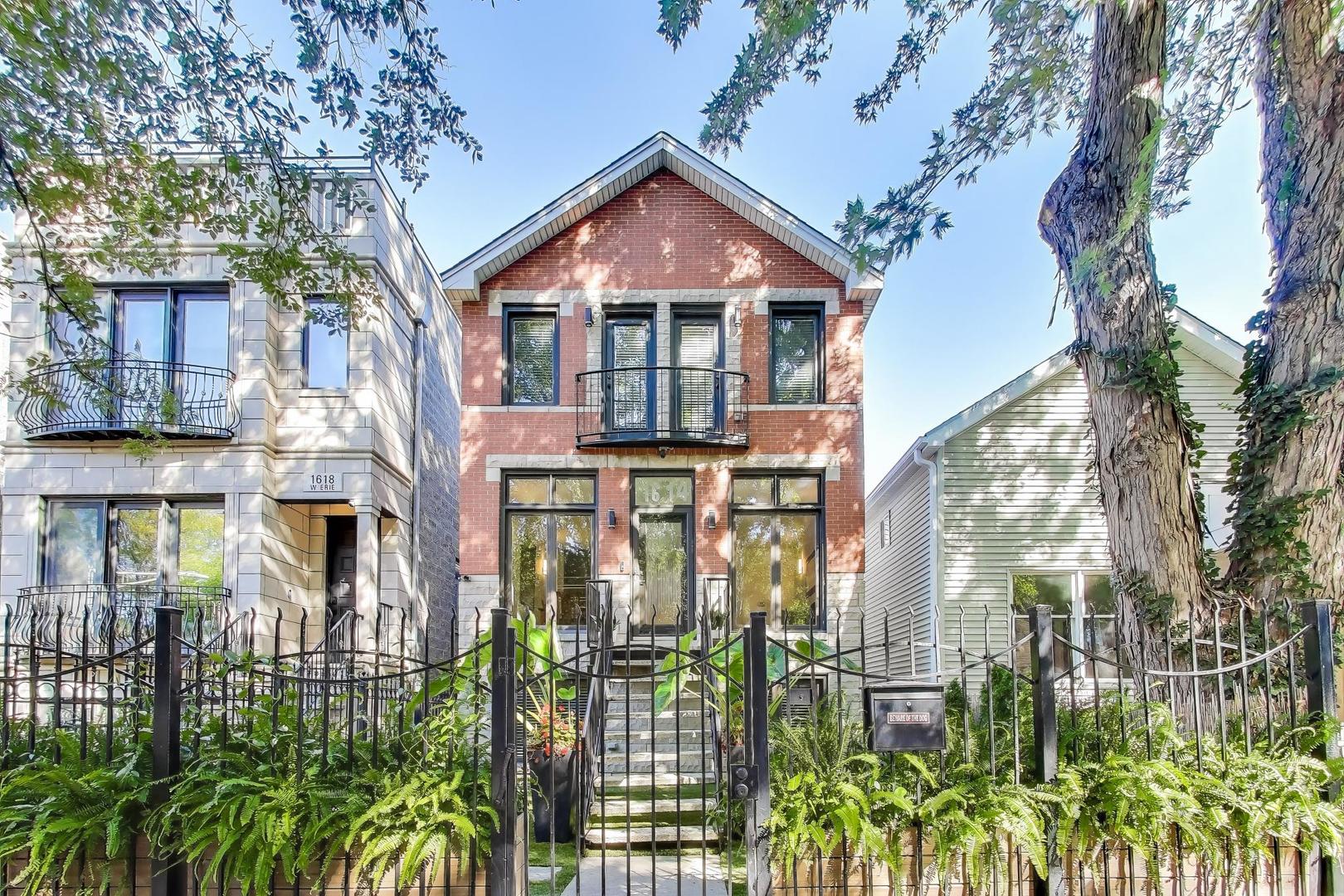 1614 West Erie Street Chicago, IL 60622 - Photo 1 of 50 a front view of a house with balcony
