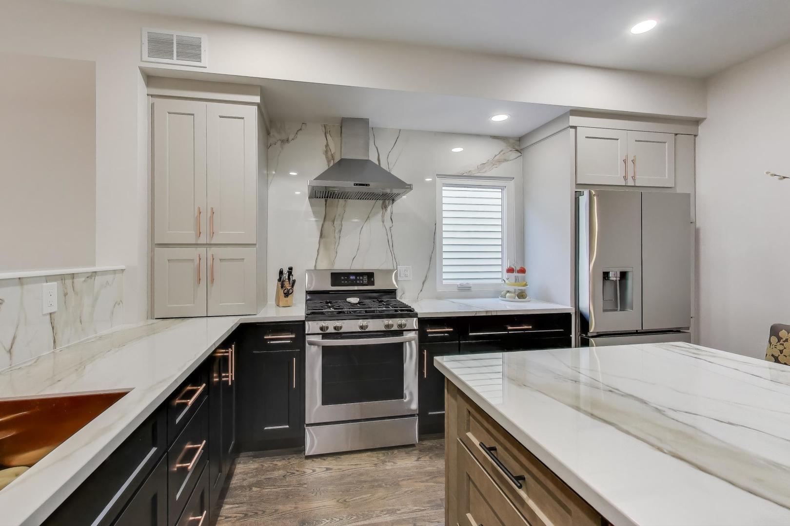 1614 West Erie Street Chicago, IL 60622 - Photo 11 of 50 a kitchen with a stove and a sink