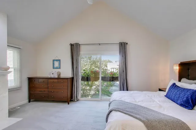 a bedroom with a bed and a television