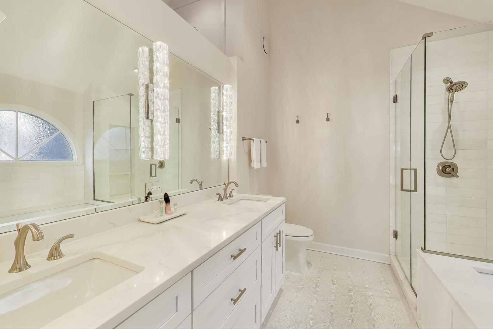1614 West Erie Street Chicago, IL 60622 - Photo 17 of 50 a bathroom with a shower sink vanity mirror and toilet