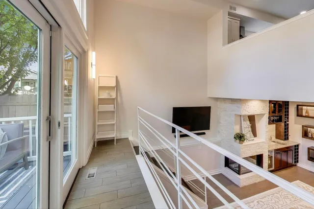 a view of a living room and a flat screen tv