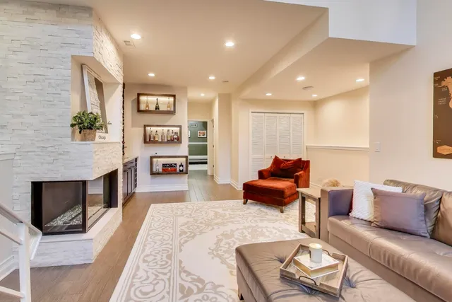 a living room with furniture and a fireplace