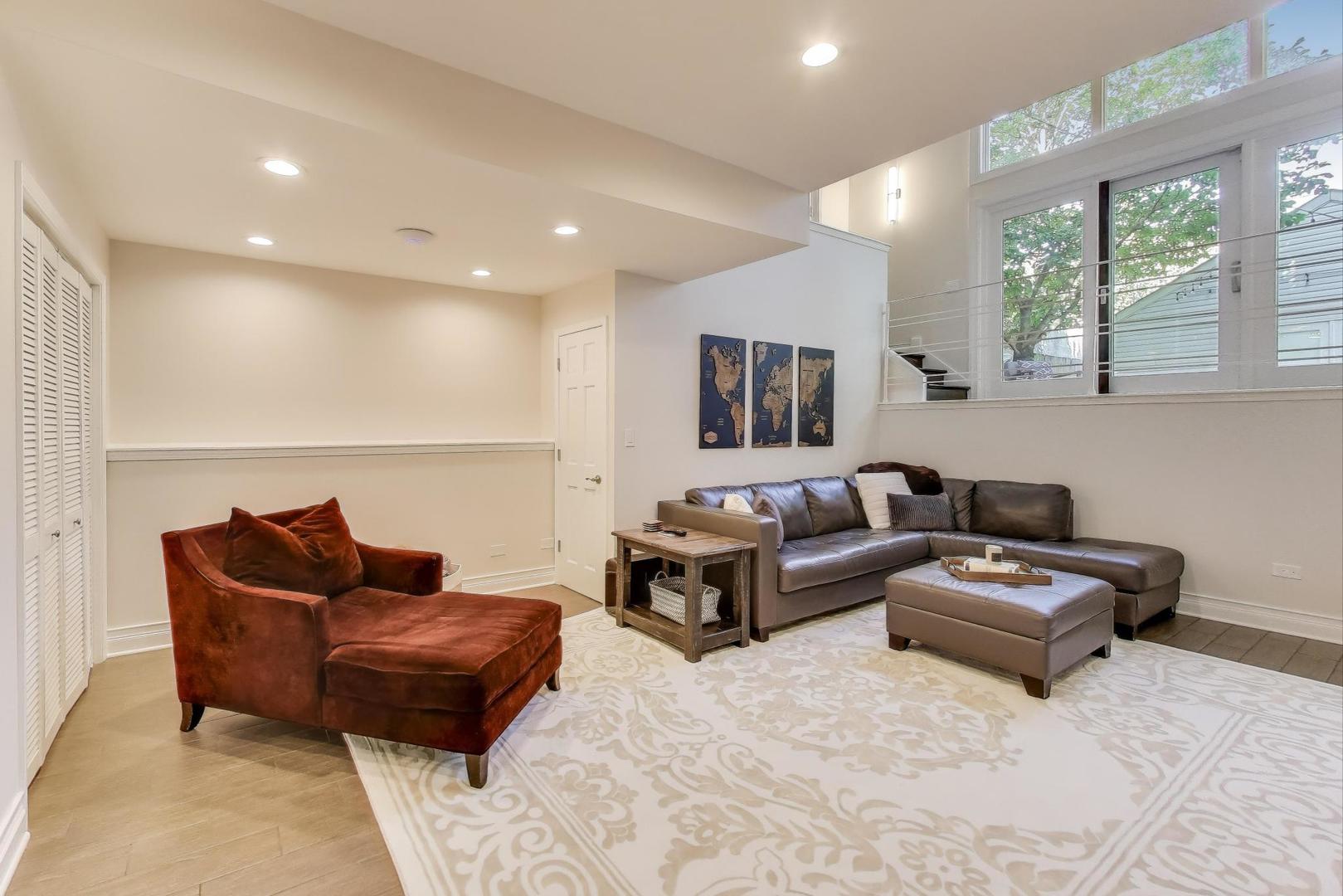 1614 West Erie Street Chicago, IL 60622 - Photo 27 of 50 a living room with furniture and a large window