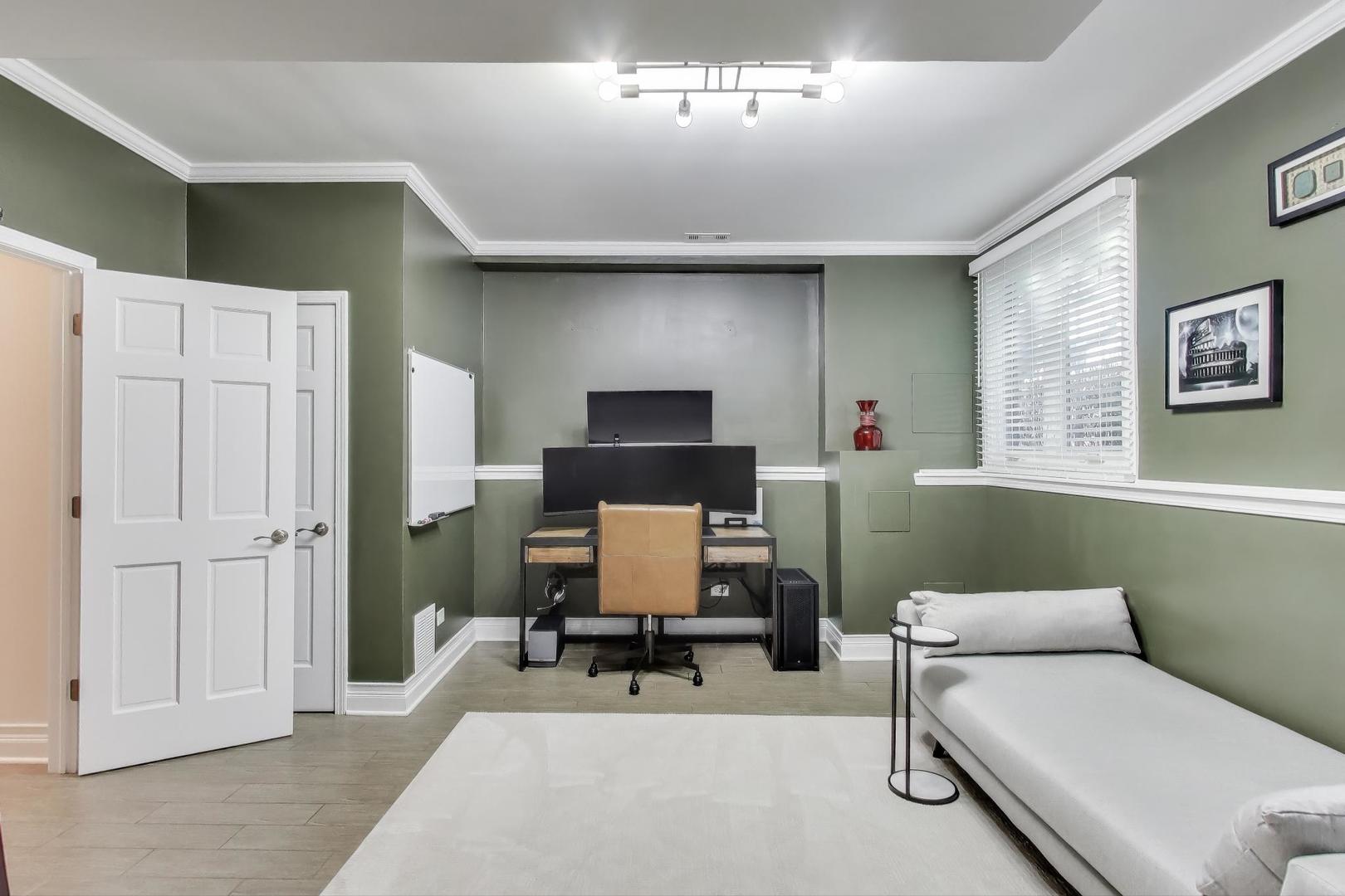 1614 West Erie Street Chicago, IL 60622 - Photo 33 of 50 a living room with furniture and a chandelier