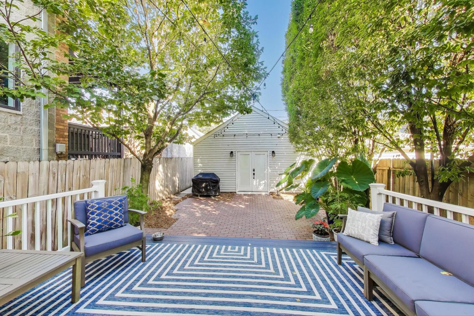 1614 West Erie Street Chicago, IL 60622 - Photo 37 of 50 a view of a patio with couches table and chairs and potted plants