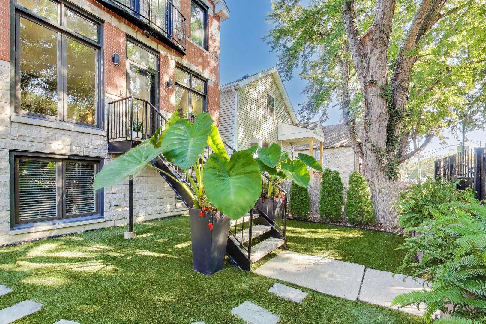 1614 West Erie Street Chicago, IL 60622 - Photo 4 of 50 a view of a house with backyard porch and sitting area
