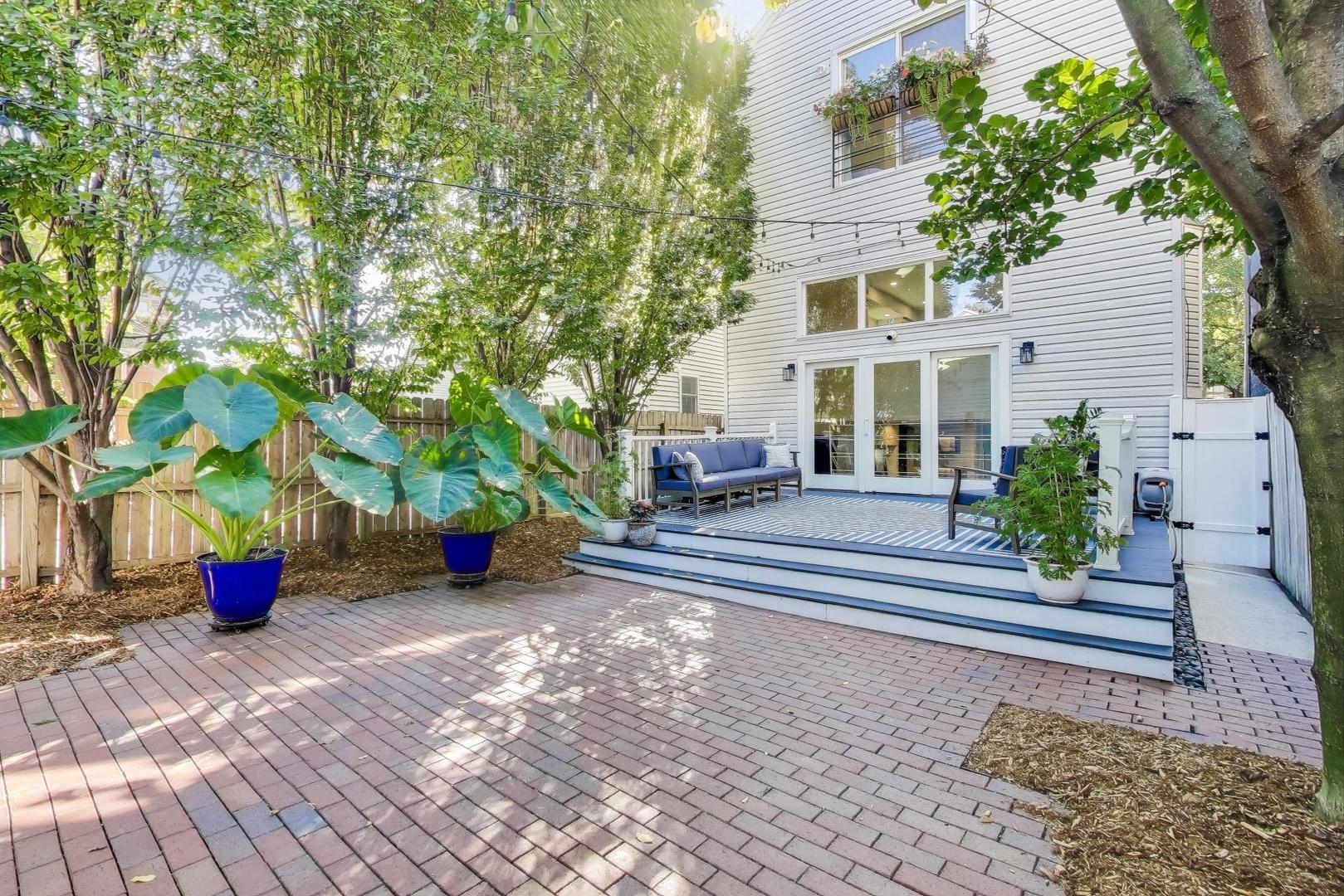1614 West Erie Street Chicago, IL 60622 - Photo 43 of 50 a view of a house with backyard and sitting area