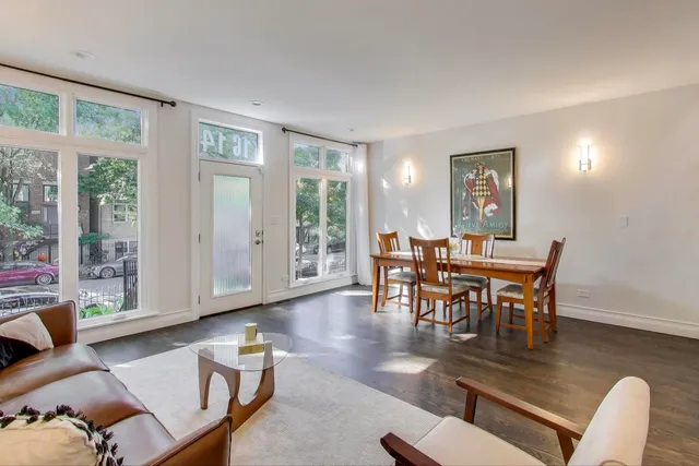 a view of a livingroom with furniture and wooden floor
