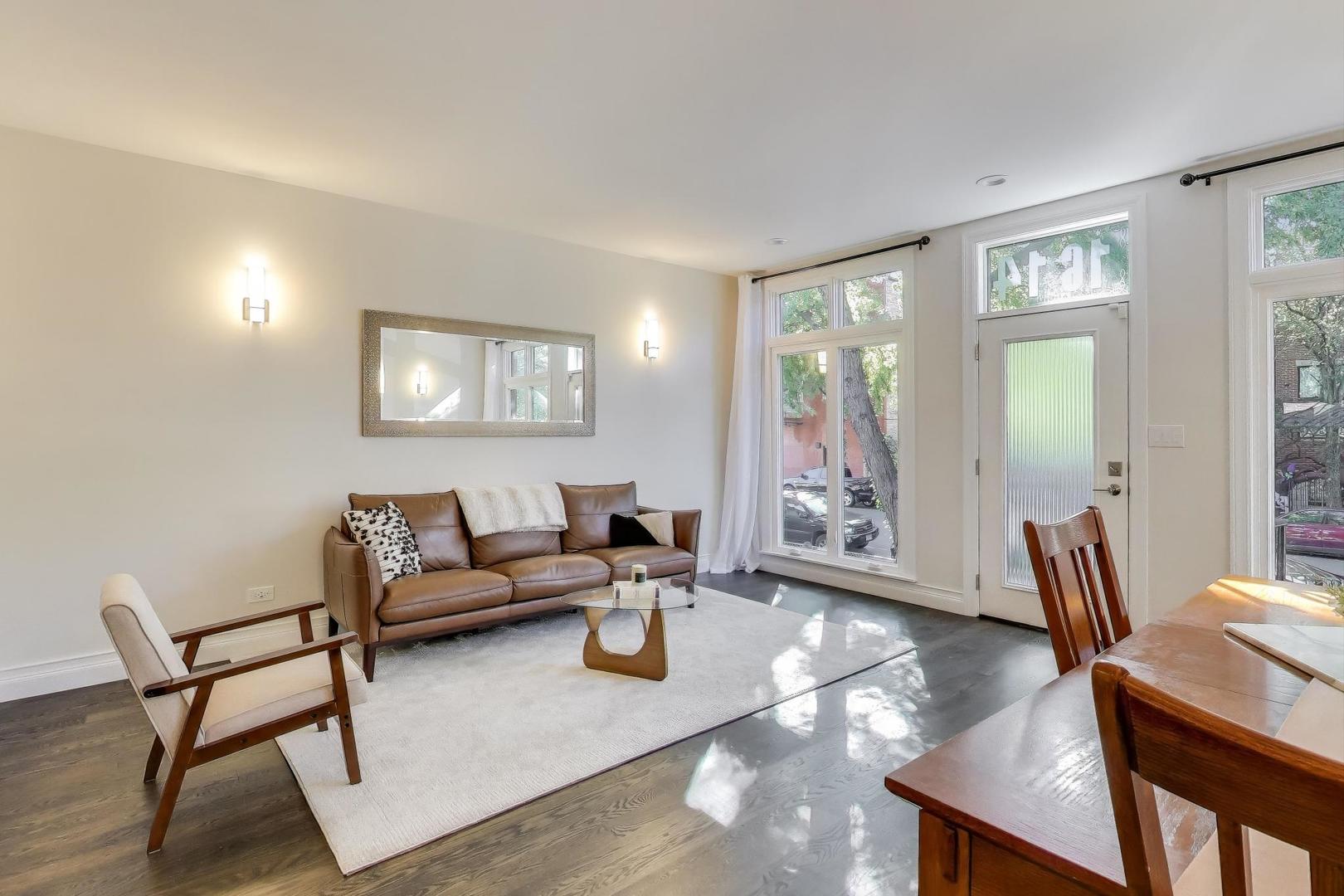 1614 West Erie Street Chicago, IL 60622 - Photo 8 of 50 a living room with furniture and a large window