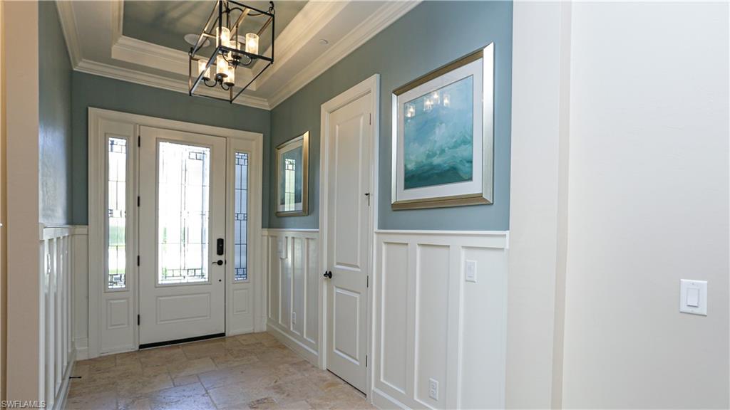 10155 Coconut Road Estero, FL 34135 - Photo 27 of 34 a view of a hallway with windows