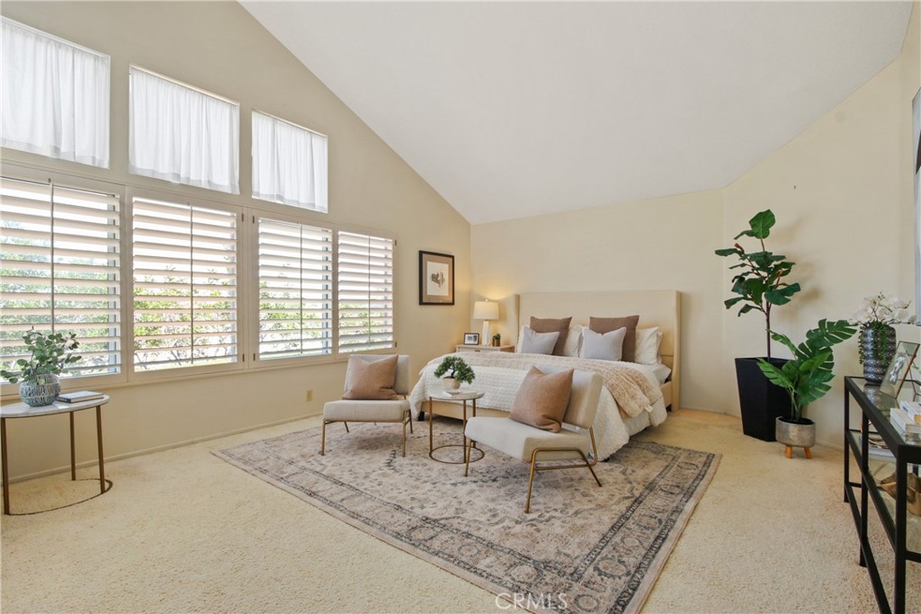 9221 Belcaro Drive Huntington Beach, CA 92646 - Photo 15 of 22 a bed room with a bed and a large window
