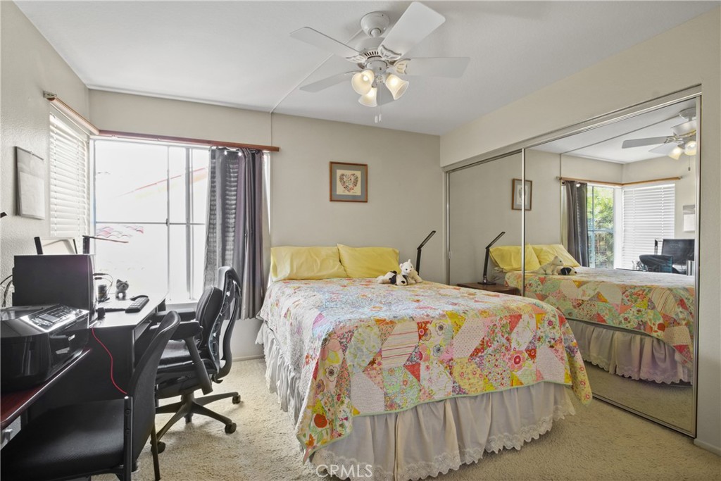 9221 Belcaro Drive Huntington Beach, CA 92646 - Photo 18 of 22 a bedroom with two beds and a desk