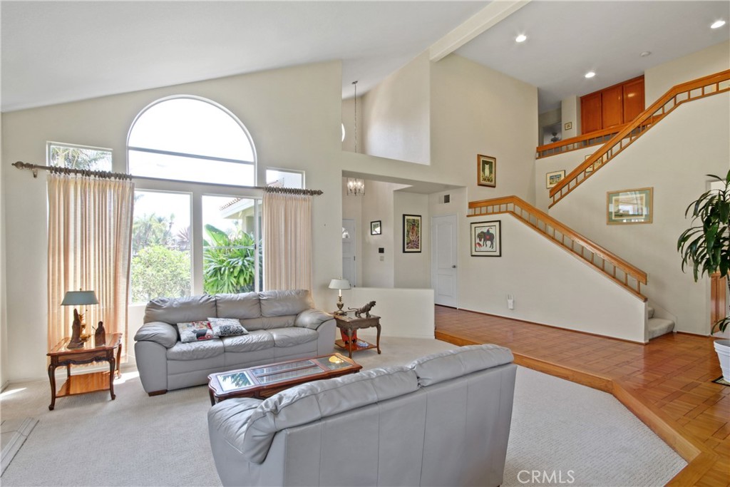 9221 Belcaro Drive Huntington Beach, CA 92646 - Photo 3 of 22 a living room with furniture and a large window